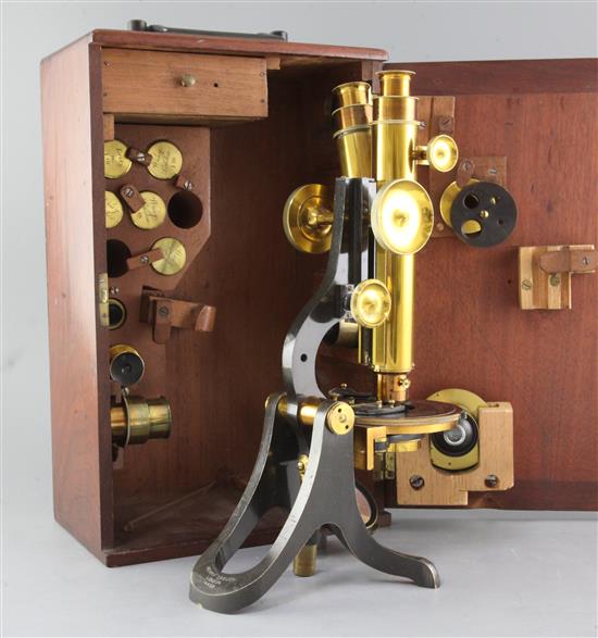 A Henry Crouch compound binocular microscope, early 20th century, height 14ins., in a mahogany case.